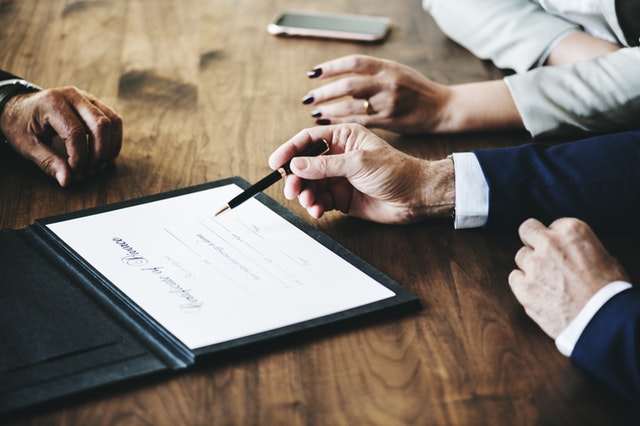 lawyer hands desk going over legal document